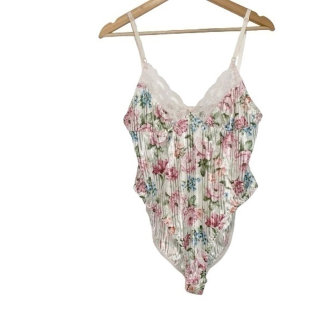 Shimmery white bodysuit with pink and blue flowers medium